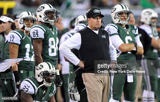 New York Jets head coach Rex Ryan and New York Jets quarterback Mark Sanchez react to an extra point attempt after fumble and touchdown in the first...