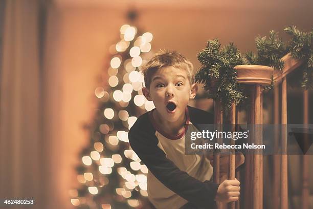 boy's christmas surprise - kid with christmas tree stock pictures, royalty-free photos & images