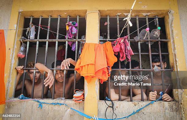 Inmates stand in their cell in the Pedrinhas Prison Complex, the largest penitentiary in Maranhao state, on January 27, 2015 in Sao Luis, Brazil....