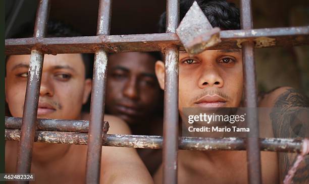 Inmates stand in their cell in the Pedrinhas Prison Complex, the largest penitentiary in Maranhao state, on January 27, 2015 in Sao Luis, Brazil....