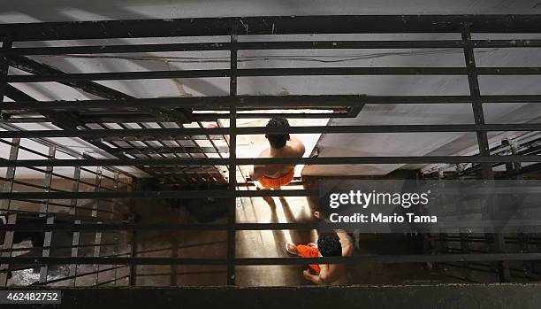 Inmates walk towards their cells in the Pedrinhas Prison Complex, the largest penitentiary in Maranhao state, on January 27, 2015 in Sao Luis,...