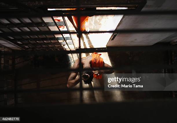 Inmates walk from their cells towards a recreation area in the Pedrinhas Prison Complex, the largest penitentiary in Maranhao state, on January 27,...