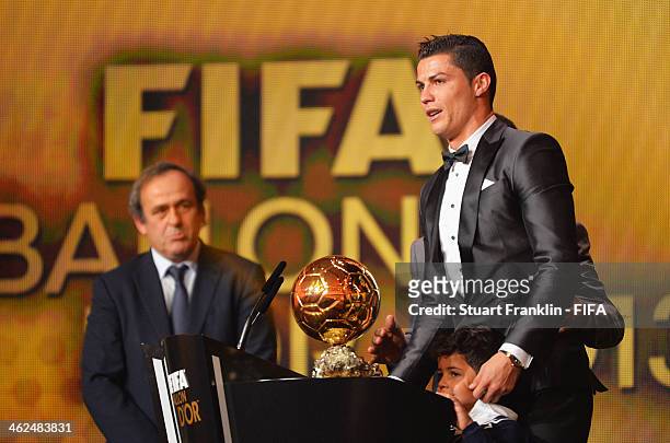Ballon d'Or winner Cristiano Ronaldo of Portugal and Real Madrid gets emotional as he collects his award with his son Cristiano Ronaldo Junior with...