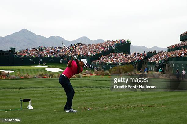 Tiger Woods hits a tee shot on the 16th hole during the first round of the Waste Management Phoenix Open at TPC Scottsdale on January 29, 2015 in...