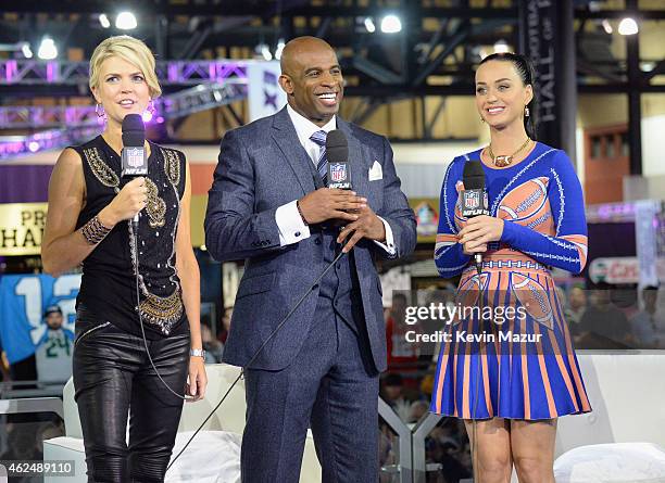 Recording artist Katy Perry is interviewed by sportscaster Melissa Stark and former NFL player and sports analyst Deion Sanders at the NFL Experience...