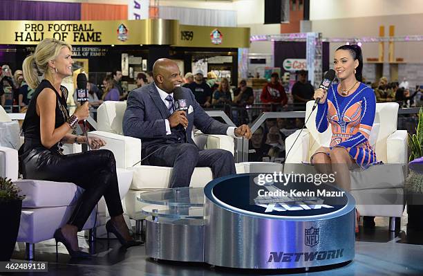 Recording artist Katy Perry is interviewed by sportscaster Melissa Stark and former NFL player and sports analyst Deion Sanders at the NFL Experience...