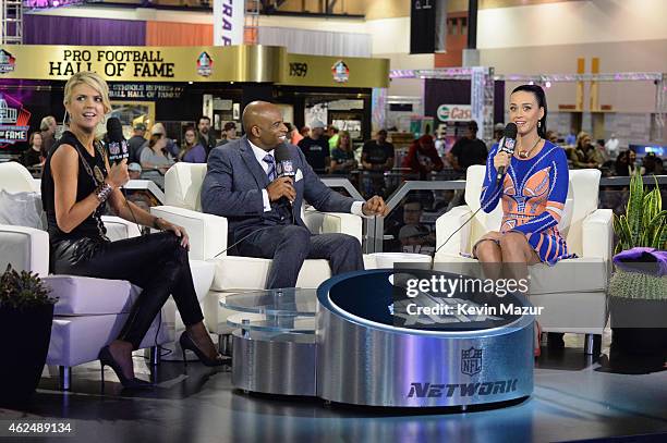 Recording artist Katy Perry is interviewed by sportscaster Melissa Stark and former NFL player and sports analyst Deion Sanders at the NFL Experience...