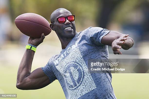 Former NFL star Terrell Owens throws a gridiron ball during a Hawthorn Hawks AFL media opportunity at Gosch's Paddock on January 30, 2015 in...