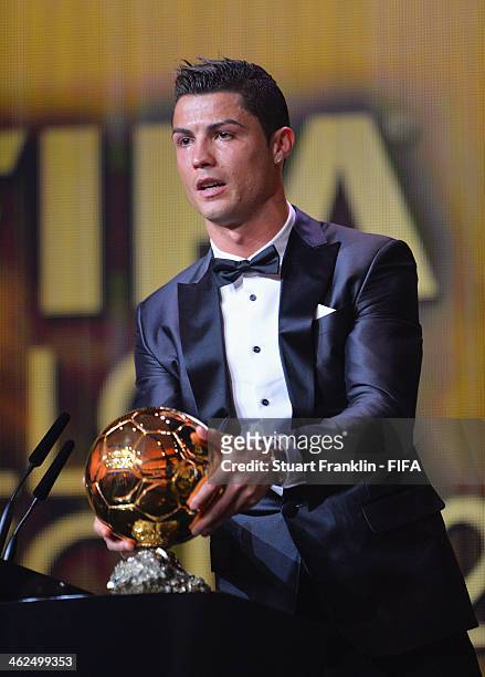 Ballon d'Or winner Cristiano Ronaldo of Portugal and Real Madrid gets emotional as he collects his award during the FIFA Ballon d'Or Gala 2013 at the...
