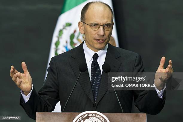 Italian Prime Minister Enrico Letta delivers a speech after signing bilateral cooperation agreements with Mexican President Enrique Pena Nieto at the...