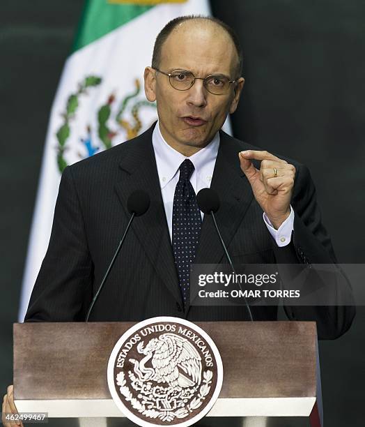 Italian Prime Minister Enrico Letta delivers a speech after signing bilateral cooperation agreements with Mexican President Enrique Pena Nieto at the...