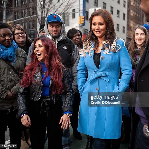 Nicole "Snooki" Polizzi and Jenni "JWoww" Farley visit "Extra" in Times Square on January 13, 2014 in New York City.