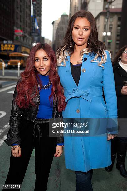 Nicole "Snooki" Polizzi and Jenni "JWoww" Farley visit "Extra" in Times Square on January 13, 2014 in New York City.