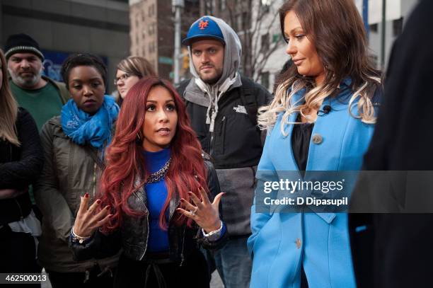 Nicole "Snooki" Polizzi and Jenni "JWoww" Farley visit "Extra" in Times Square on January 13, 2014 in New York City.