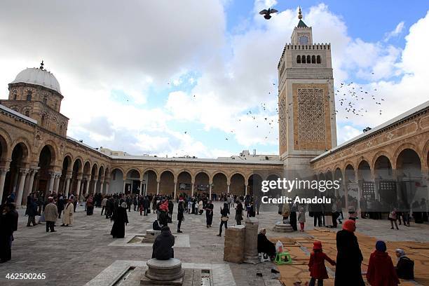 People attend the celebrations marking the birth of Prophet Muhammad at Al-Zaytuna Mosque in Tunis, Tunisia, January 13, 2014.