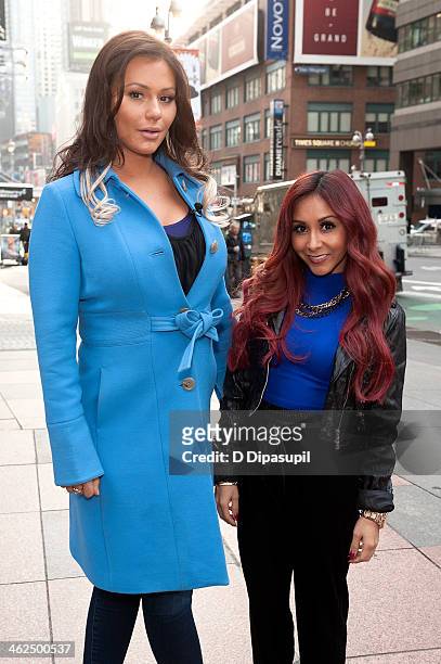 Jenni "JWoww" Farley and Nicole "Snooki" Polizzi visit "Extra" in Times Square on January 13, 2014 in New York City.