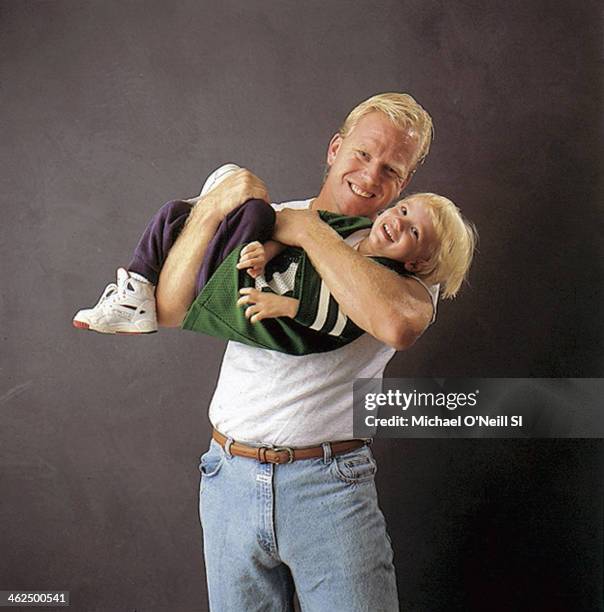 Former football player Boomer Esiason is photographed with son Gunnar for Sports Illustrated on September 20, 1993 in New York City. CREDIT MUST...