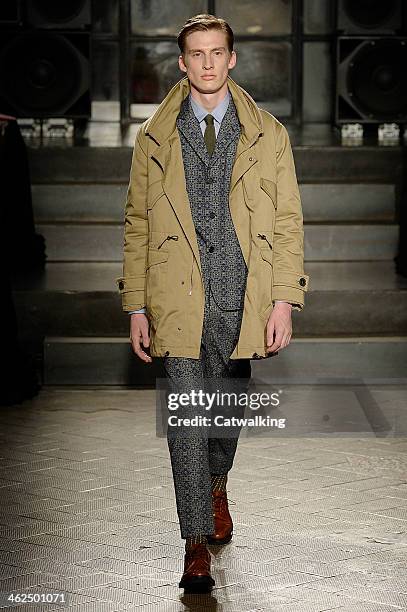 Model walks the runway at the Antonio Marras Autumn Winter 2014 fashion show during Milan Menswear Fashion Week on January 13, 2014 in Milan, Italy.