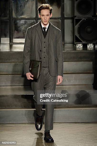 Model walks the runway at the Antonio Marras Autumn Winter 2014 fashion show during Milan Menswear Fashion Week on January 13, 2014 in Milan, Italy.