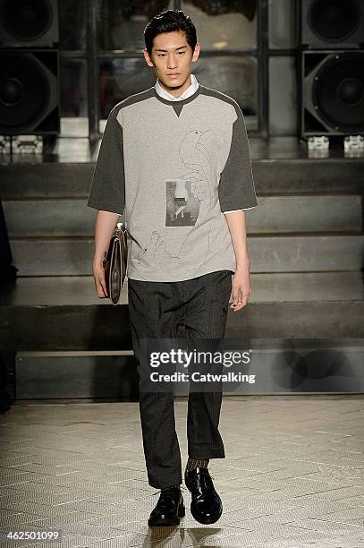 Model walks the runway at the Antonio Marras Autumn Winter 2014 fashion show during Milan Menswear Fashion Week on January 13, 2014 in Milan, Italy.