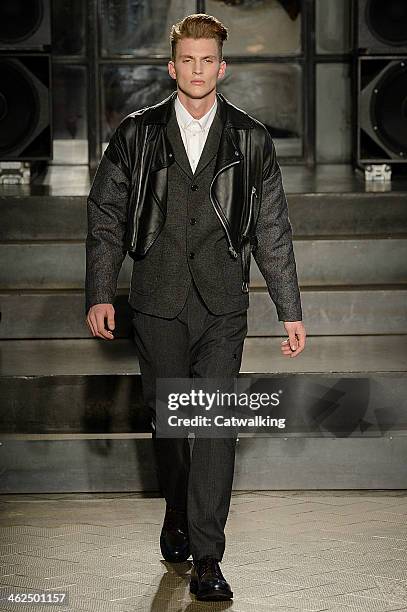 Model walks the runway at the Antonio Marras Autumn Winter 2014 fashion show during Milan Menswear Fashion Week on January 13, 2014 in Milan, Italy.