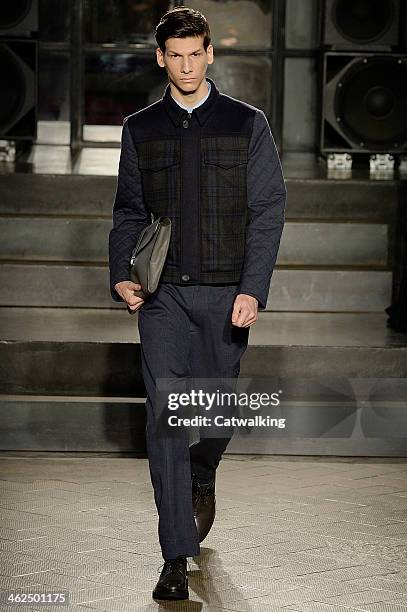 Model walks the runway at the Antonio Marras Autumn Winter 2014 fashion show during Milan Menswear Fashion Week on January 13, 2014 in Milan, Italy.