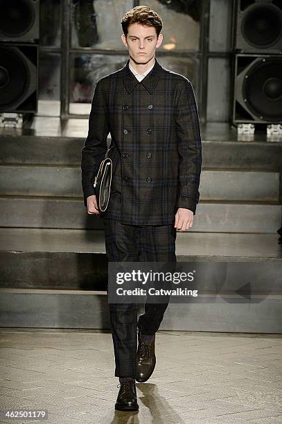 Model walks the runway at the Antonio Marras Autumn Winter 2014 fashion show during Milan Menswear Fashion Week on January 13, 2014 in Milan, Italy.