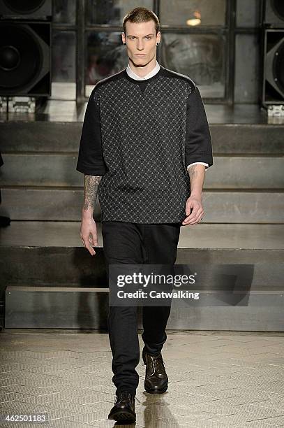 Model walks the runway at the Antonio Marras Autumn Winter 2014 fashion show during Milan Menswear Fashion Week on January 13, 2014 in Milan, Italy.