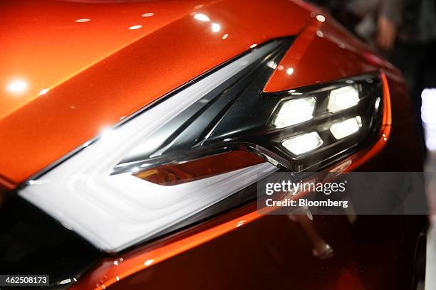 The headlight of a Nissan Sport Sedan concept vehicle is displayed after being unveiled during the 2014 North American International Auto Show in...