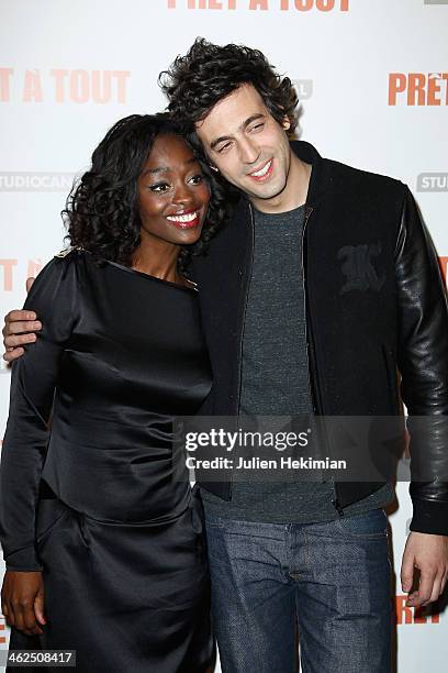 Aissa Maiga and Max Boublil attend 'Pret A Tout' Paris Premiere at Cinema Gaumont Marignan on January 13, 2014 in Paris, France.