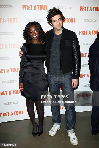 Aissa Maiga and Max Boublil attend 'Pret A Tout' Paris Premiere at Cinema Gaumont Marignan on January 13, 2014 in Paris, France.
