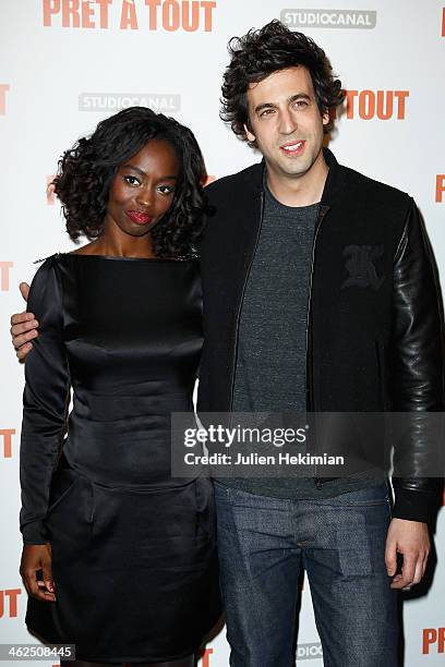 Aissa Maiga and Max Boublil attend 'Pret A Tout' Paris Premiere at Cinema Gaumont Marignan on January 13, 2014 in Paris, France.