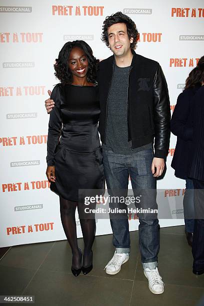 Aissa Maiga and Max Boublil attend 'Pret A Tout' Paris Premiere at Cinema Gaumont Marignan on January 13, 2014 in Paris, France.