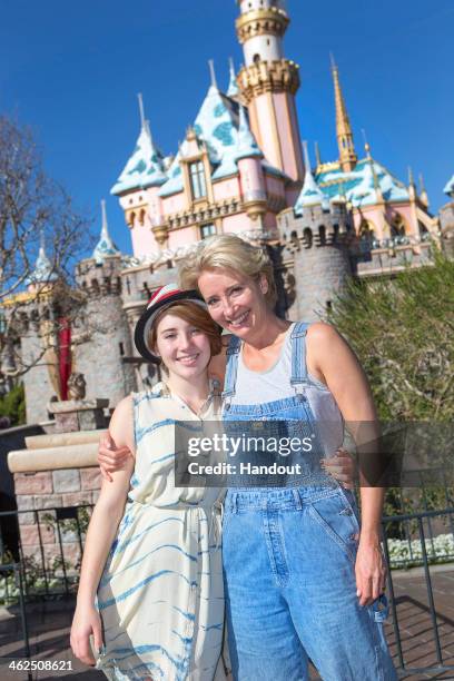 In this handout photo provided by Disney Parks, Emma Thompson and her daughter, Gaia Wise pose in front of Sleeping Beauty Castle at Disneyland on...