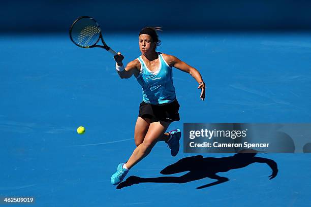 Lourdes Dominguez Lino of Spain plays a forehand in her first round match against Caroline Wozniacki of Denmark during day two of the 2014 Australian...