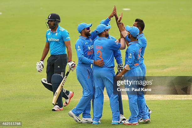 Stuart Binny of India celebrates the dismissal of Ravi Bopara of England with team mates during the One Day International match between England and...