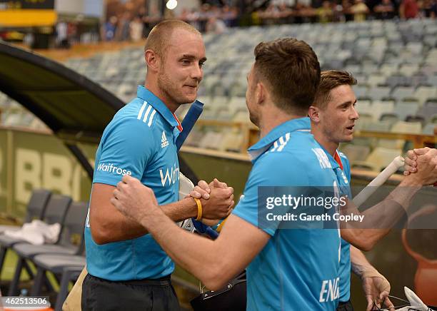 Stuart Broad of England shakes hands with James Anderson of England after winning the One Day International match between England and India at WACA...