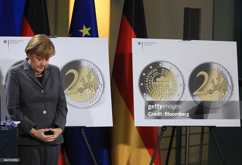 Germany's Chancellor Angela Merkel Unveils Two-Euro Reunification Coin