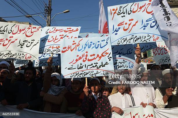 Pakistani demonstrators march in a protest against the printing of satirical sketches of the Prophet Muhammad by French magazine Charlie Hebdo in...