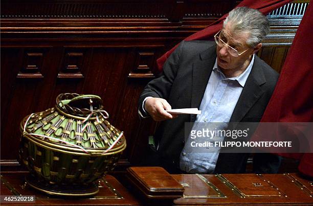 Former leader of Italy's Northern League party Umberto Bossi casts his ballot at the Italian Parliament in Rome on January 30 on the second day of...