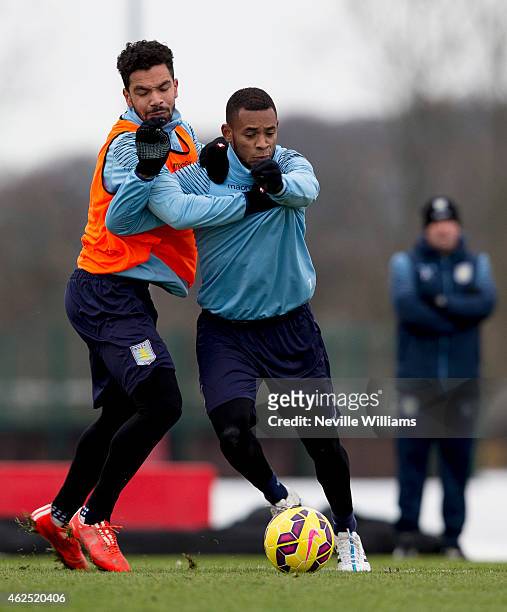 Kieran Richardson of Aston Villa in action with team mate Leandro Bacuna during a Aston Villa training session at the club's training ground at...