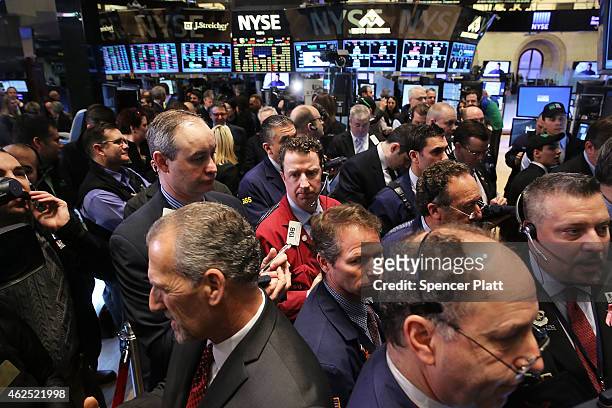 Traders work on the floor of the New York Stock Exchange on January 30, 2015 in New York City. Hamburger chain Shake Shack rose more than 130 percent...