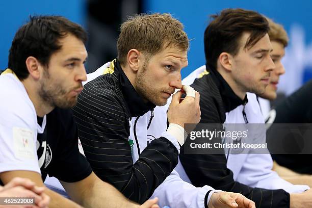 Michael Mueller, Steffen Weinhold and Patrick Groetzki of Germany look thoughtful during the placement round between Croatia and Germany at Ali Bin...