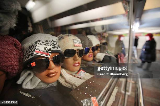 Ruble price signs sit on hats for sale in the window of a clothing store in Moscow, Russia, on Friday, Jan. 30, 2015. European Union governments...