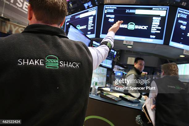 Traders work on the floor of the New York Stock Exchange on January 30, 2015 in New York City. Hamburger chain Shake Shack rose more than 130 percent...