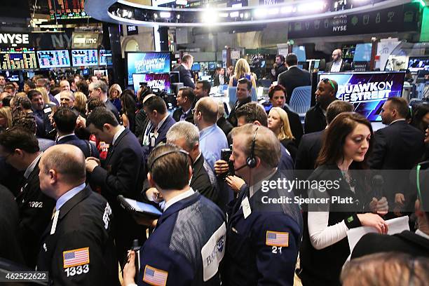 Traders work on the floor of the New York Stock Exchange on January 30, 2015 in New York City. Hamburger chain Shake Shack rose more than 130 percent...