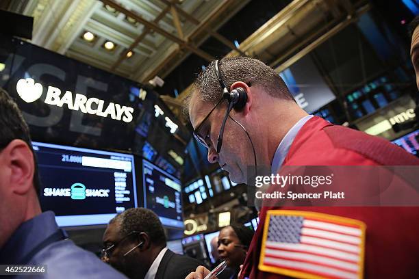 Traders work on the floor of the New York Stock Exchange on January 30, 2015 in New York City. Hamburger chain Shake Shack rose more than 130 percent...