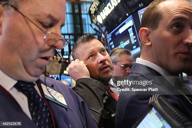 Traders work on the floor of the New York Stock Exchange on January 30, 2015 in New York City. Hamburger chain Shake Shack rose more than 130 percent...