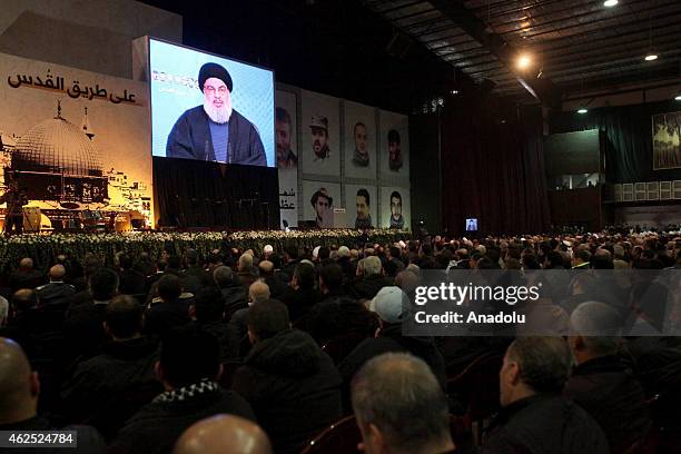 Hezbollah chief Hassan Nasrallah speaks via video conference during the commemoration ceremony for killed militants of Hezbollah in Syria, on January...