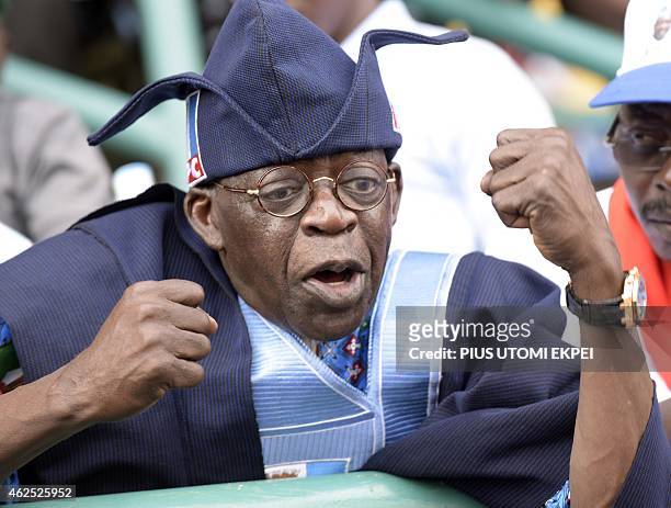 Bola Tinubu, one of the leaders of Nigeria's leading opposition All Progressive Congress, tries to calm the crowd after violence broke out during a...